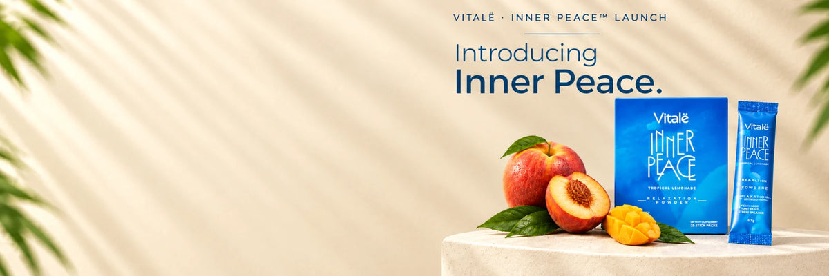 Introducing Vitalë Inner Peace: the box and a stick pack beside fresh peach and mango